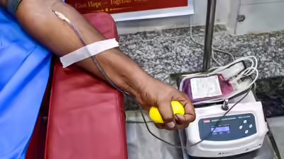 A volunteer donates blood during the world blood donor day in prayagraj uttar pradesh pti photo.jpg