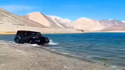Ladakh fines tourists for driving into lake.jpg