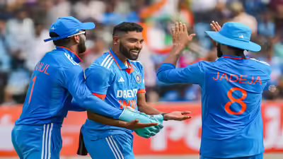 Rajkot indias mohammed siraj celebrates with teammates after taking the wicket.jpg
