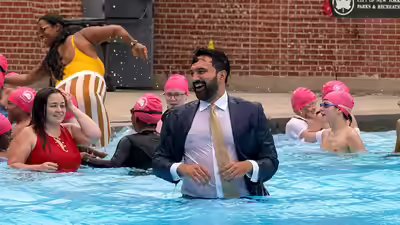 Zohran mamdani dives into nyc pool in suit.jpg
