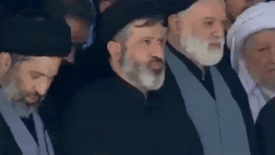Ayatollah ali khameneis sons praying at his funeral.jpg