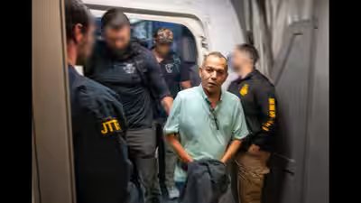 Khalid satary at washington dulles international airport after he was extradited to the us.jpg