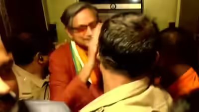 Shashi tharoor being brought out of the lift.jpg