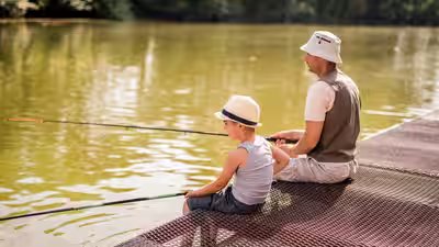 8 year old reels in piranha at pennsylvania lake.jpg