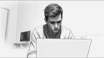 Melancholy young man at laptop.jpg