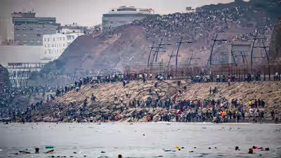 Migrants cross into spains ceuta enclave from morocco in photos.jpg