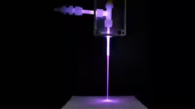 The prototype laundry gun in action during a fabric treatment test.jpg